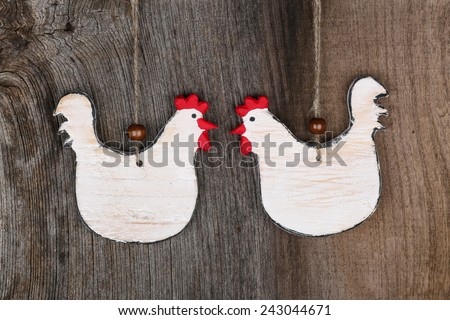 Funny welcome white chicken rooster hen country cottage kitchen wood shape sign decoration toy on old rough background with copy space