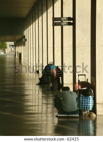 Homeless man in Japanese train station.