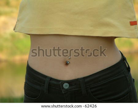 Small female waist with belly-button ring.