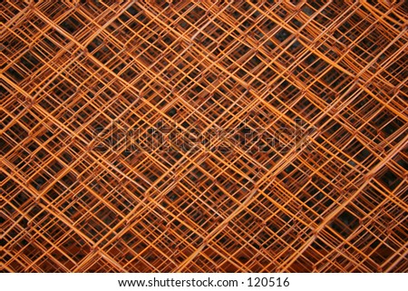 Mesmerizing burnt orange fence with many layers and depths.