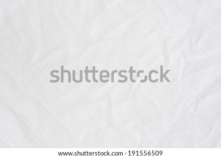 Wrinkle white cotton polyester fabric texture, detailed closeup, rustic crumpled vintage fabric.