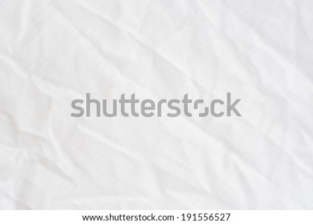 Wrinkle white cotton polyester fabric texture, detailed closeup, rustic crumpled vintage fabric.