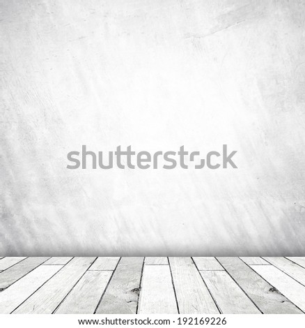 White cement wall and old wood floor, empty perspective room in light tone.