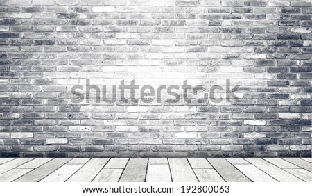 Brick wall and old wood floor, empty perspective room in light tone.