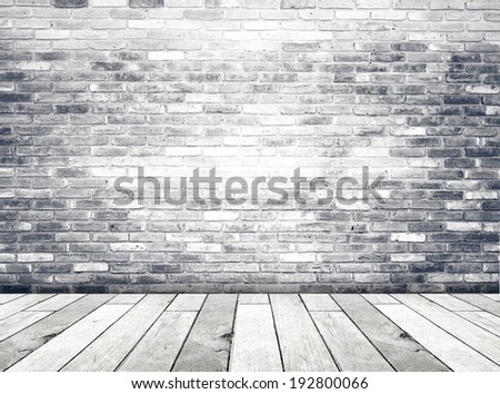 Brick wall and old wood floor, empty perspective room in light tone.