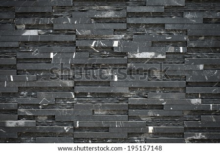 Modern marble brick stone wall, dark tone background.