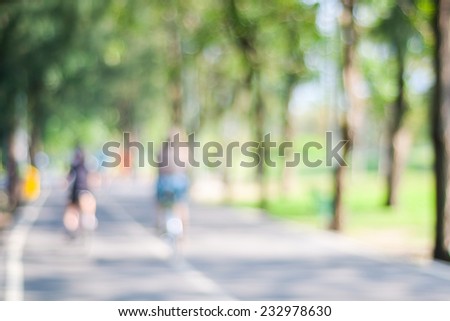 Blurred background of people activities in park with bokeh