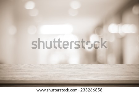 Vintage filtered empty table and blurred store with bokeh background, product display template.