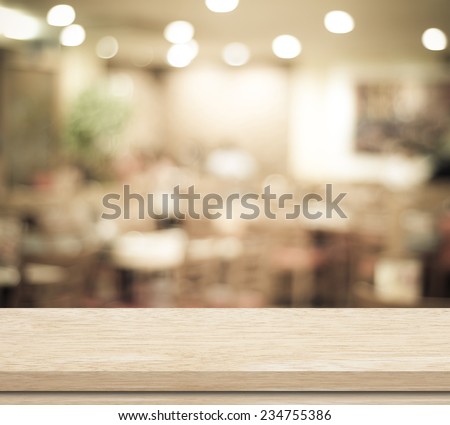 Empty table and blurred restaurant with bokeh background, product display template.