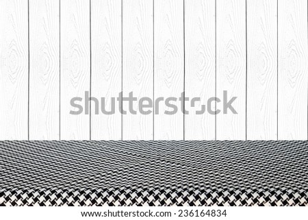 Empty table covered with black and white checked tablecloth background, for product display montage