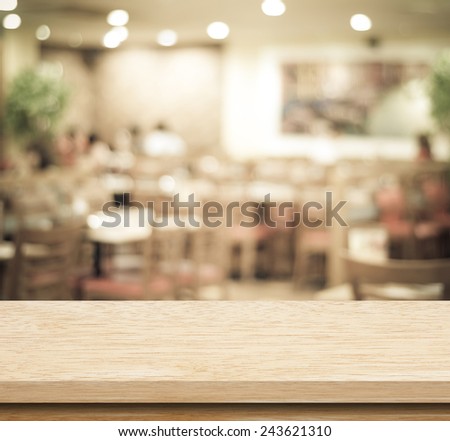 Empty table and blurred restaurant with bokeh background, product display template.