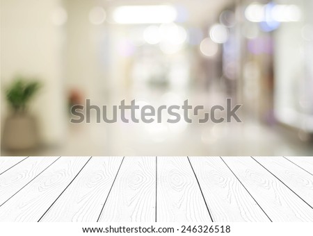White wood perspective and blurred store with bokeh background, product display template.