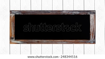 Empty vintage chalk board on white wood wall background, wording template