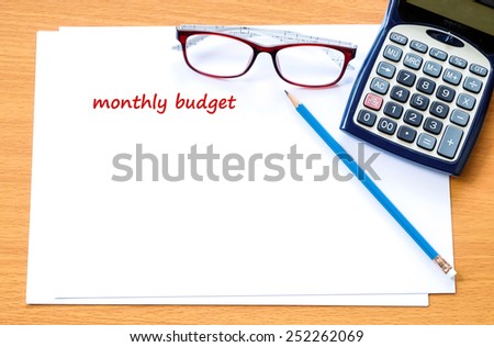 Monthly budget on paper background, financial concept