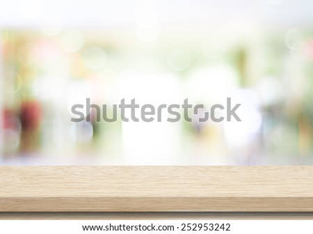 Empty table and blurred store with bokeh background, product display