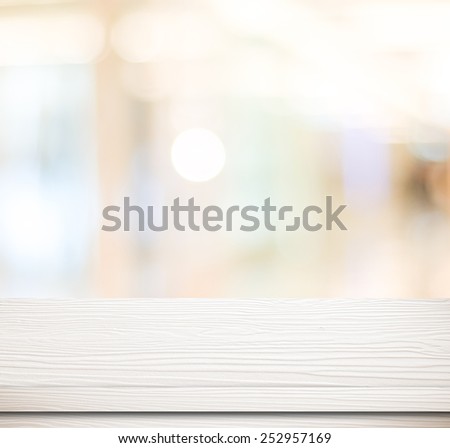 Empty white table and blurred store bokeh background, product display