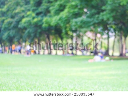 Blurred background of people activities in park with bokeh, spring and summer season