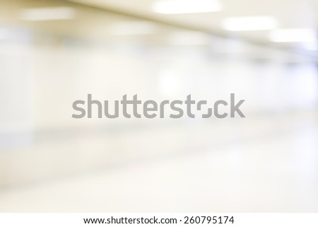 Blur inside office building with bokeh light background, business background