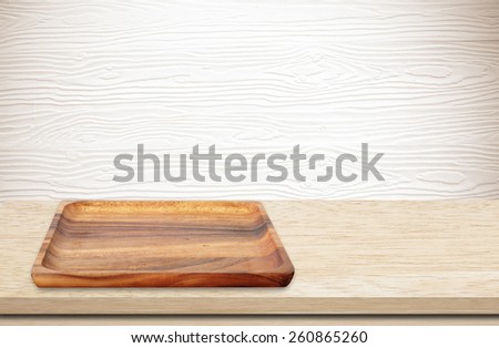 Blank wood tray on table background, product display montage
