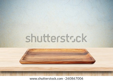 Blank wood tray on table background, product display montage
