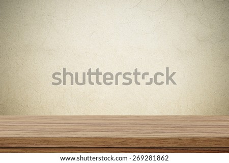 Empty wooden table over cement wall background, product display montage
