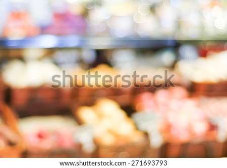 Blur fruits shelf in supermarket with bokeh light background