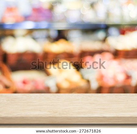 Empty table over blur supermarket with bokeh background, Product shelf