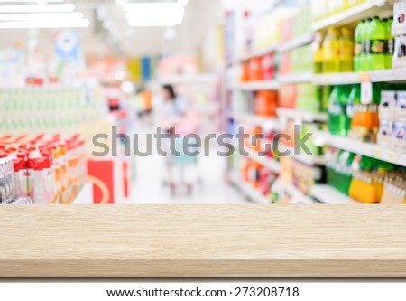 Empty table over blur supermarket with bokeh background, product display, template, business concept