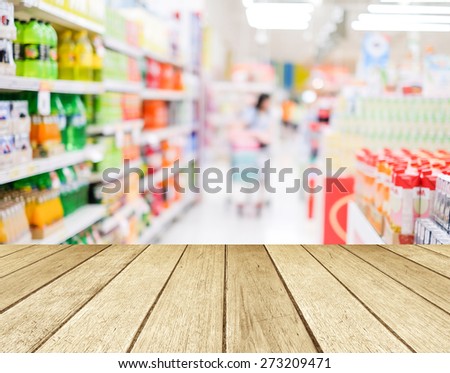 Perspective wood over blur supermarket with bokeh background, Product display, template, business concept