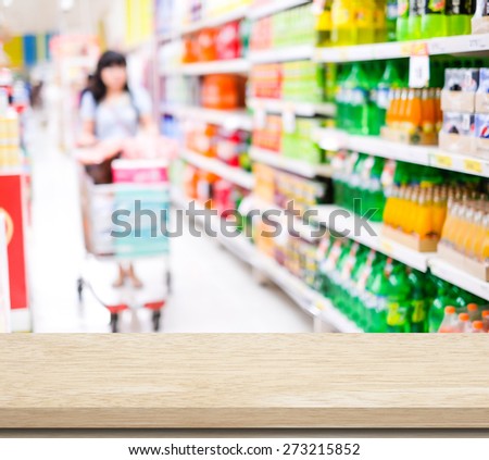 Empty table over blur supermarket with poeple background, product display, template, business concept