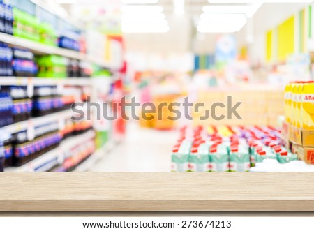 Empty table over blur supermarket background, product display, template, business concept
