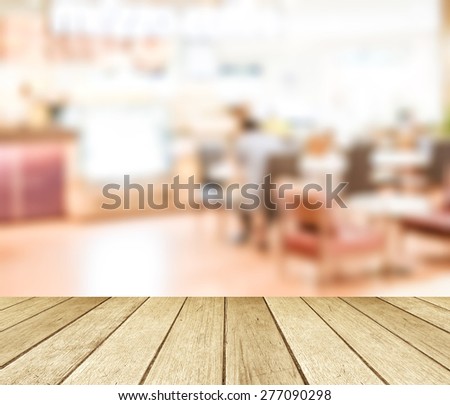 Perspective wood and blurred cafe with bokeh light background, product display montage