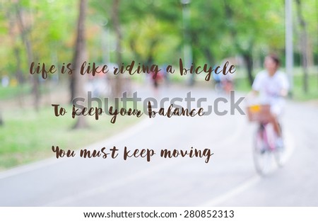 Motivational Quote on blurred background, Life is Like Riding a Bicycle To Keep Your Balance You Must Keep Moving.