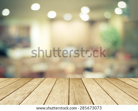Perspective wood over blurred restaurant with bokeh background, foods and drinks, product display montage