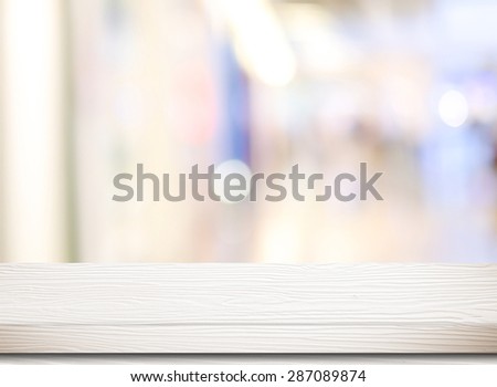 Empty white table and blurred store bokeh background, product display montage