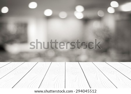 Perspective wood and blurred cafe with bokeh light background. product display template
