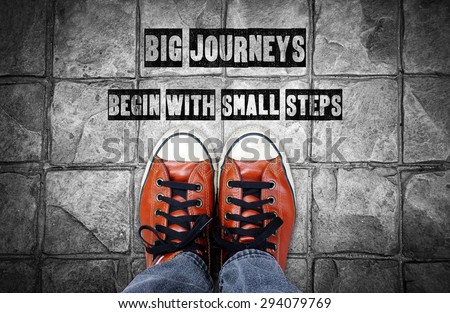 Big journeys begin with small steps, Inspiration quote, shoes on pavement