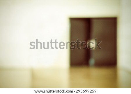 Blur opened door in office building with boken light background, business background