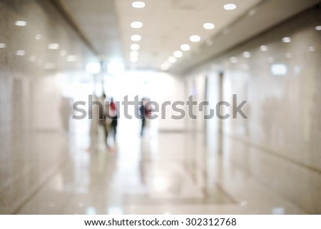 Blur inside office building with people and bokeh light background, interior and business background