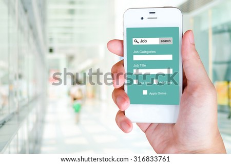 Job search on smart phone screen over blur office and people background, business concept
