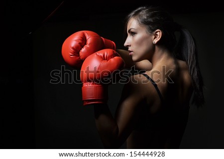 Beautiful Woman With The Red Boxing Gloves,Black Background