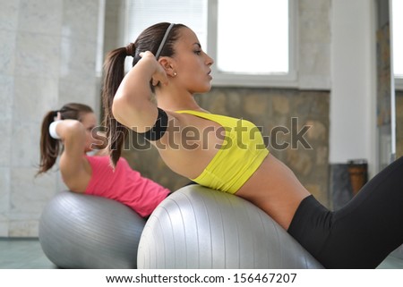 beautiful young women working out in the fitness studio beautiful young women working out in the fitness studio