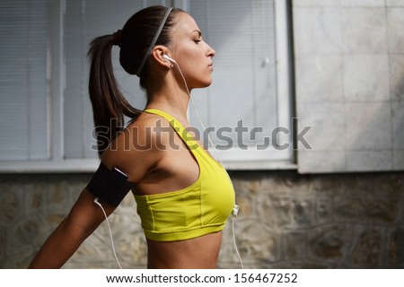 beautiful young woman working out in the fitness studio