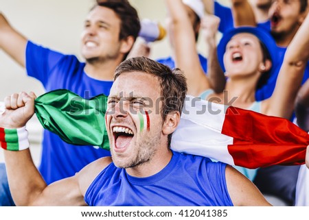 Supporters from Italy at stadium watching the match