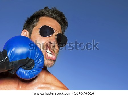 Man being hit in the face with a boxing glove.