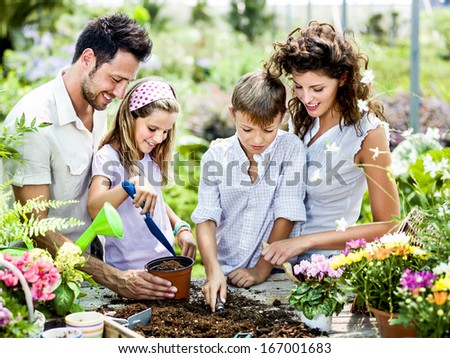 Family Have Fun In The Work Of Gardening