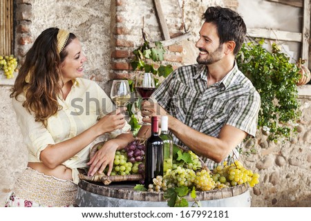 farming couple drinking wine in their old farm