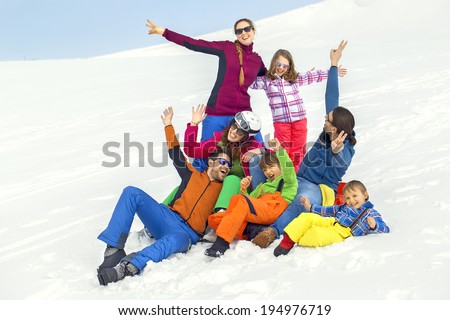 large group of friends having fun in the snow