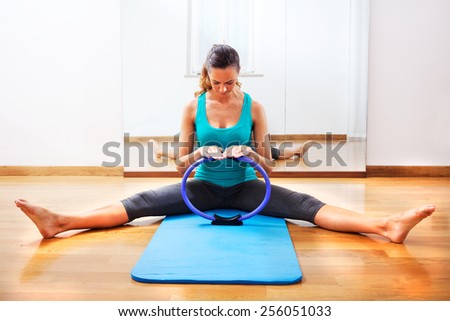 Fitness teacher making exercisese with the circle tool