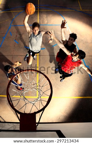 young basketball players playing with energy